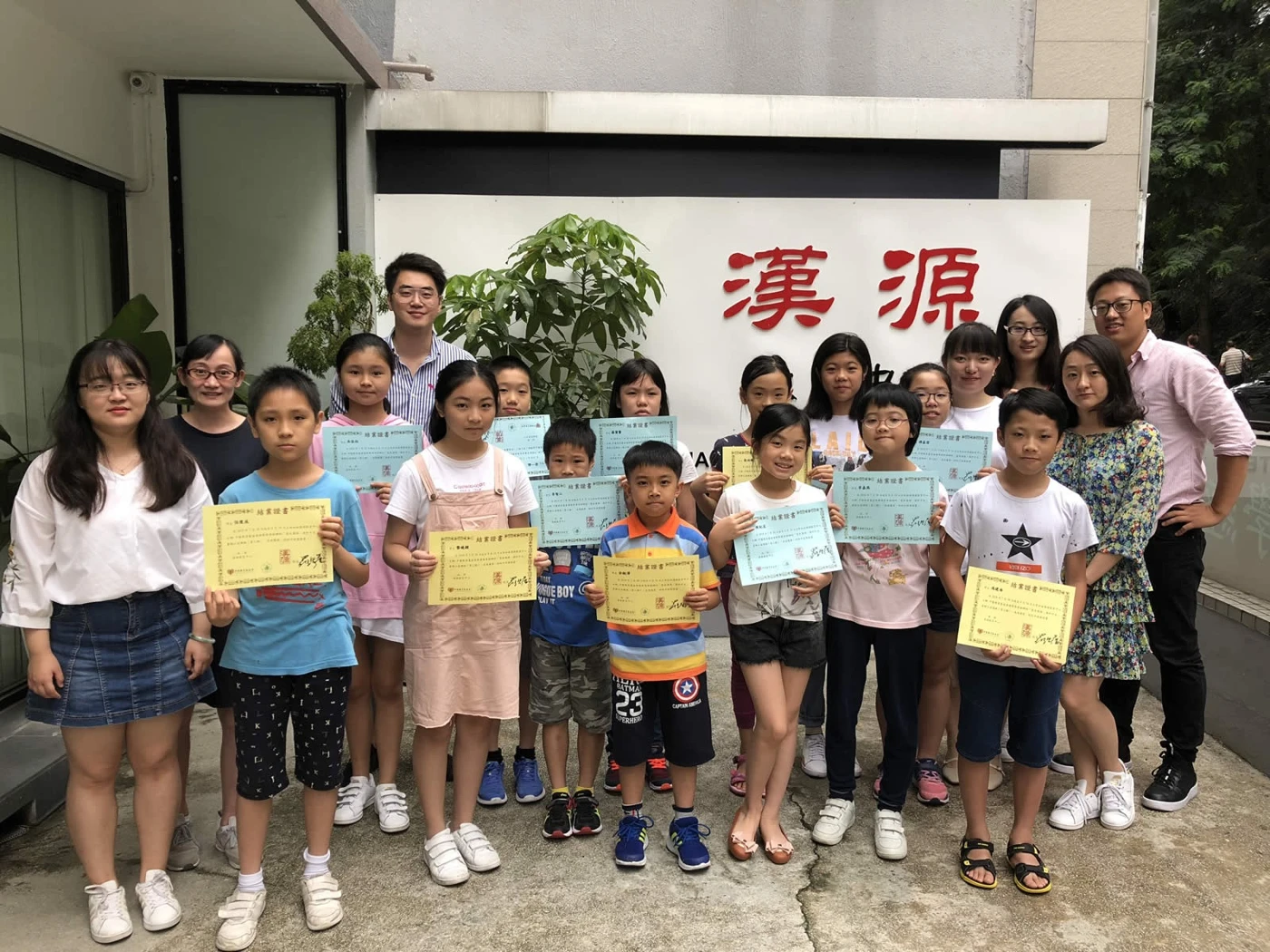 Students with their certificates outside Han Yuan